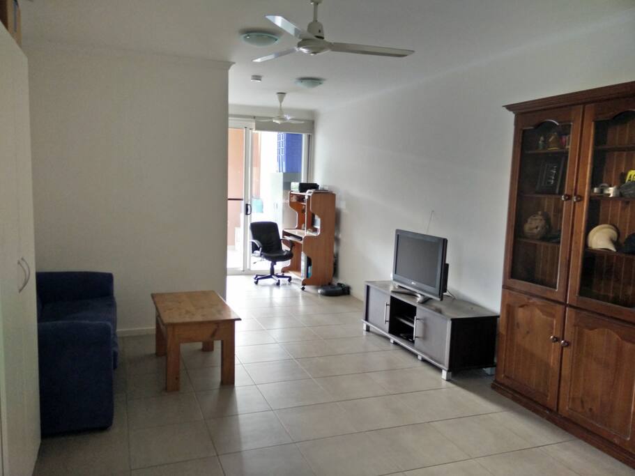 Lounge room and access to veranda, with a large LCD TV