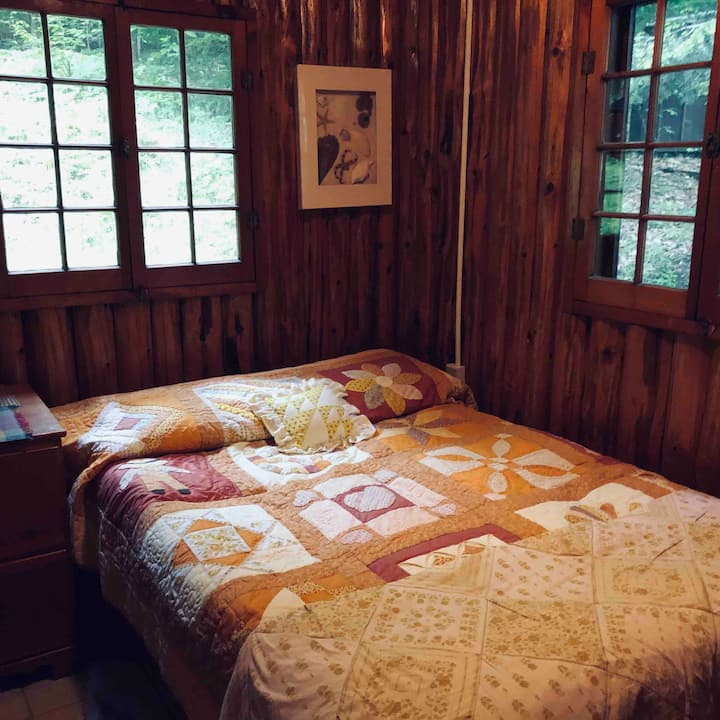 Master bed room with full size bed and private wooded views.  We do have storage shed off to that side. 