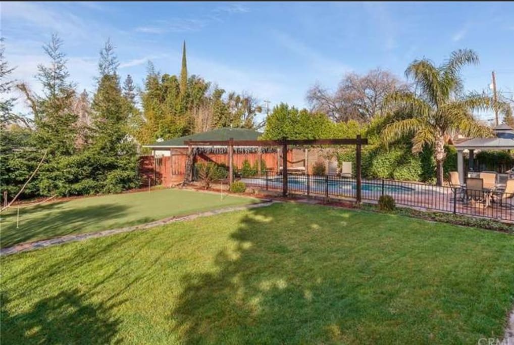 quiet backyard with putting green.