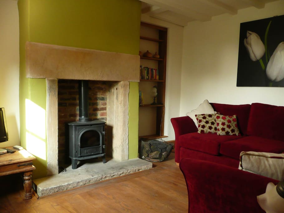 Cosy comfortable lounge with wood burning stove