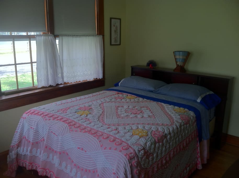 Front bedroom with Queen bed and adjacent bathroom