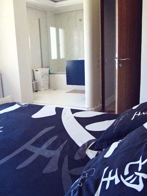 The master bedroom with its private bath and toillete