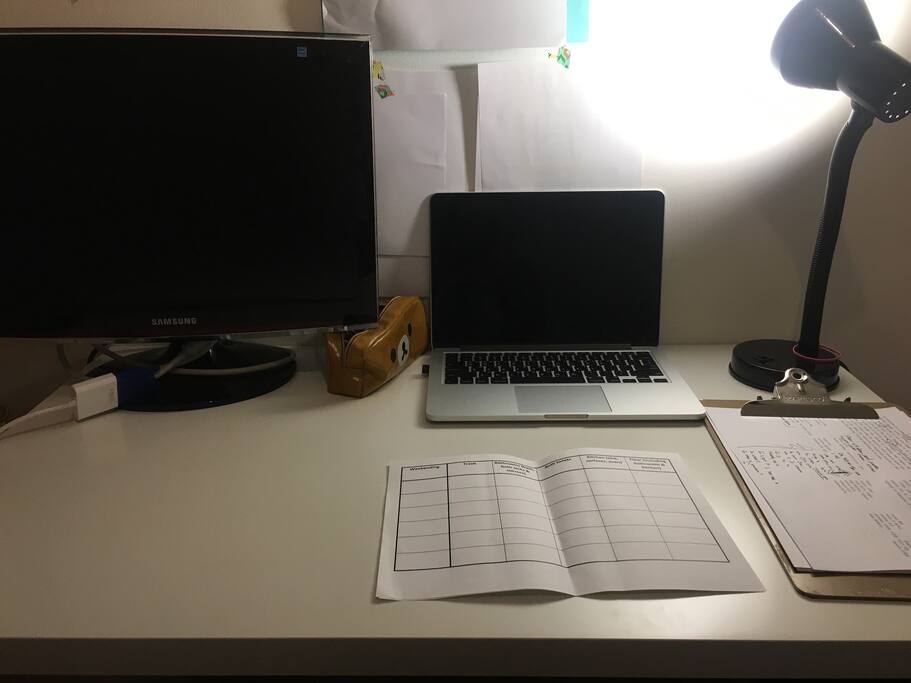 Desk, monitor and lamp.