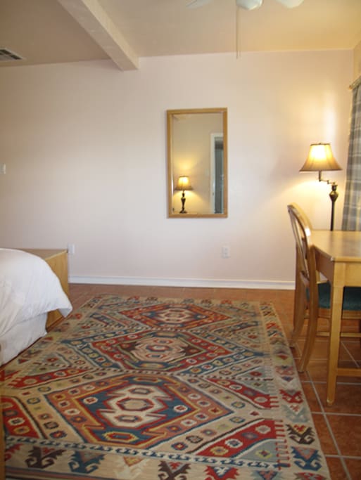 View from stairs leading to kitchen and closet area