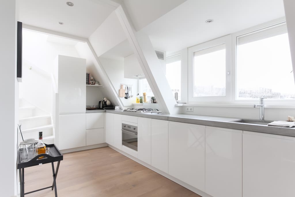 beautiful kitchen which has a remarkable view over the neighborhood