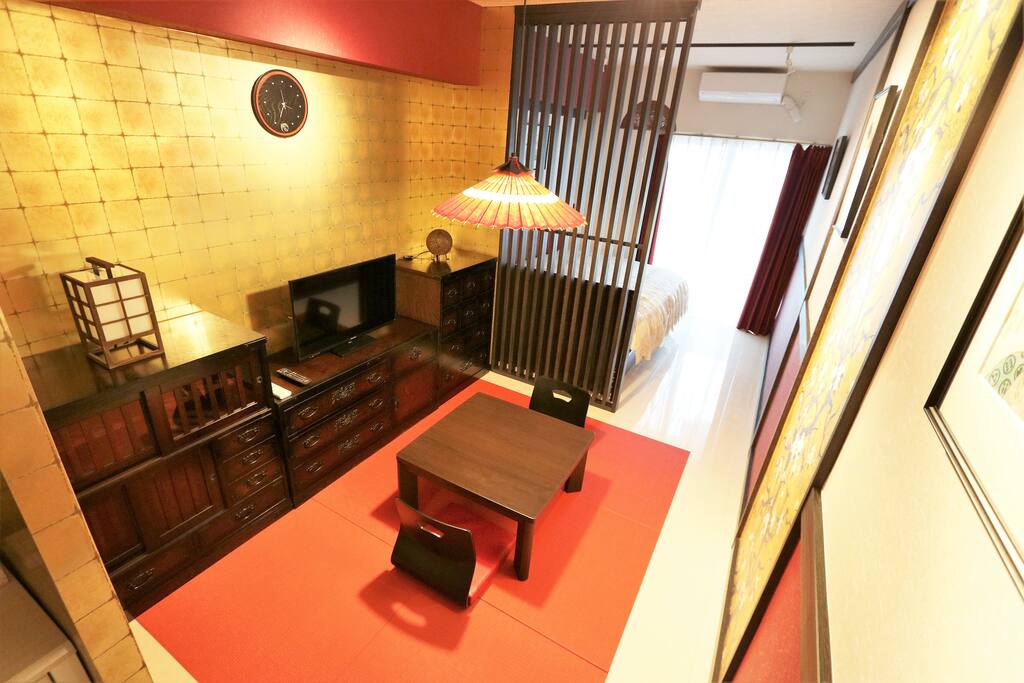 The room has traditional yet minimalist dining area which also serves as the living room where the flat screen TV is located.