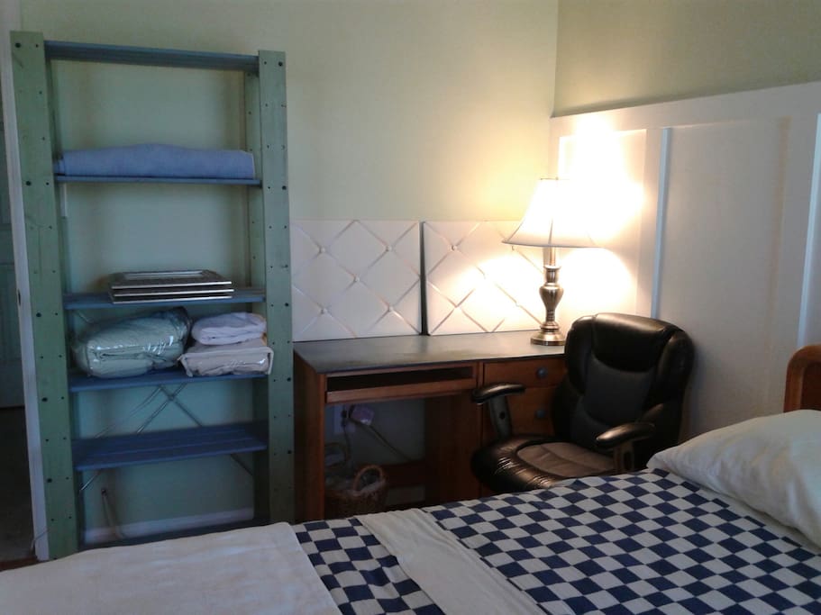 Full size bed with an attached private bathroom and entrance from bedroom