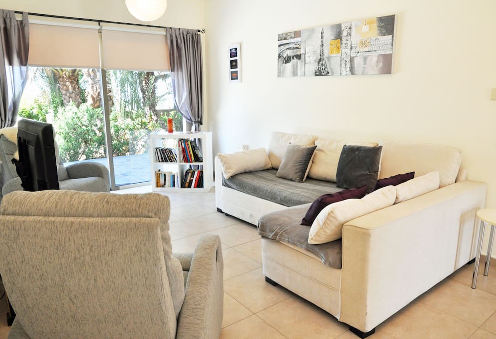 Living Area with TV (DVD Player & Chrome Cast, Wifi, Two Reclining Chairs, L-Shaped Sofa, Books & DVDs