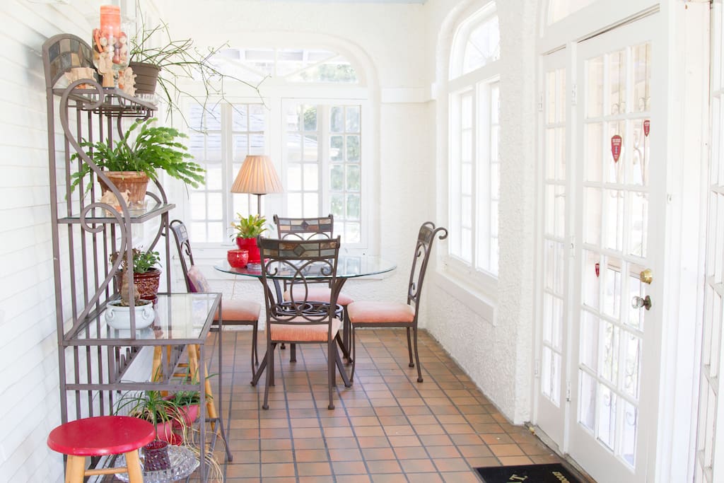 The fully enclosed porch/sunroom is great for coffee, relaxation and hanging out.