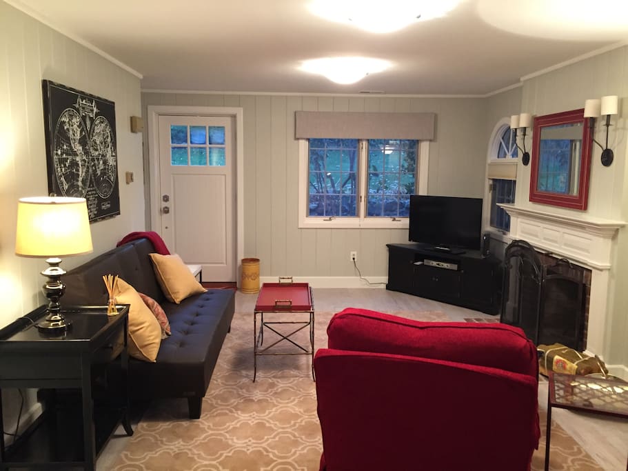 Family room with couch that opens to a full size bed