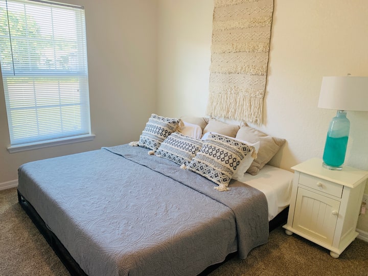 The zen room. Third guest room with low profile king sized bed and ample closet space.
