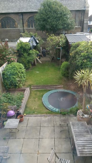 Large garden with trampoline