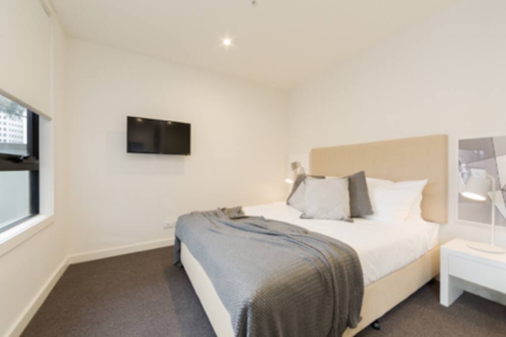 Master bedroom with Queen Size bed, wall mounted TV