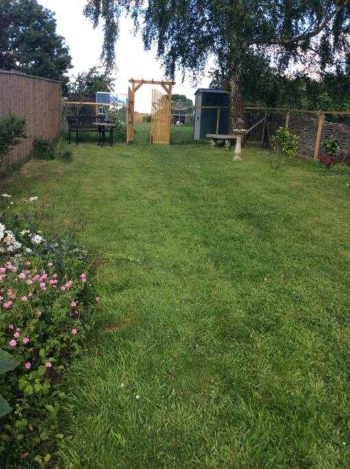 Back garden, which guest bedroom overlooks