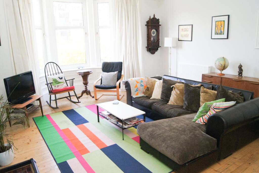 Spacious Living Room with a corner sofa and piano