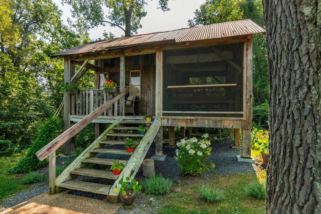Repurposed barn board from property used to build the treehouse including the tin for the roof