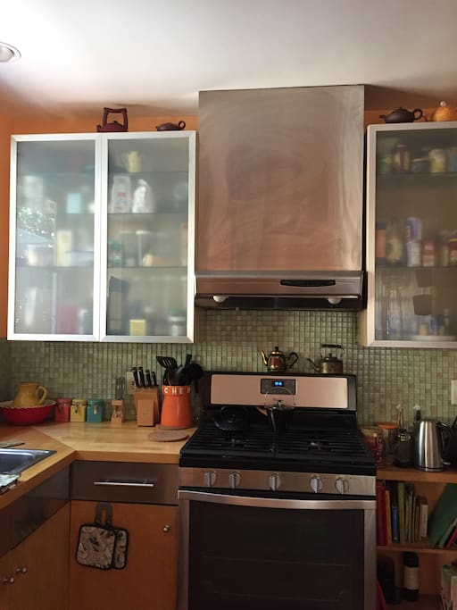 Updated kitchen with stainless steel appliances, french door fridge, glass tile.
