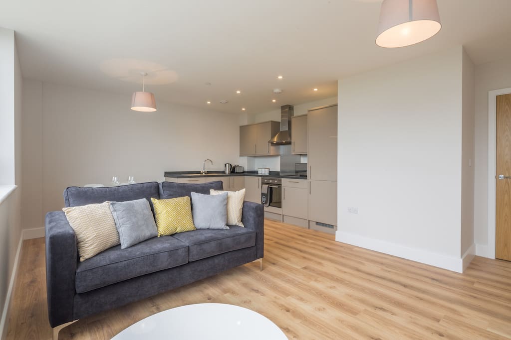 Open plan living room with sofa bed, Smart TV, fully equipped kitchen and dining table