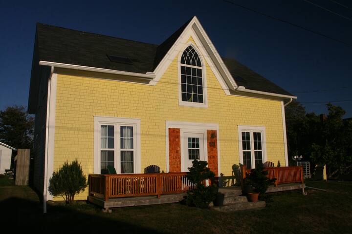 Yellow summer house near the ocean.