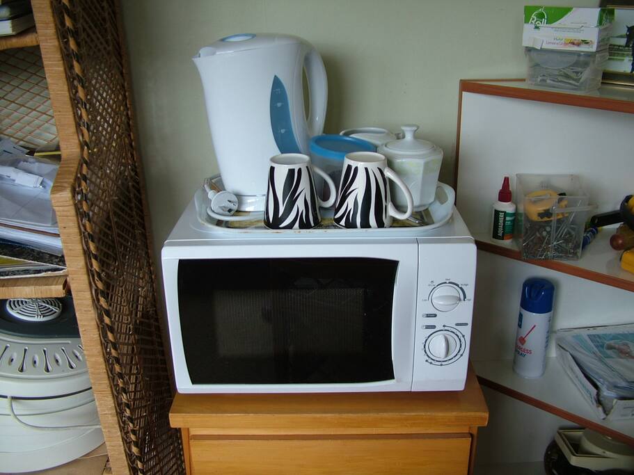 Microwave, plus hot water jug, tea, coffe, milk, sugar - enjoy!