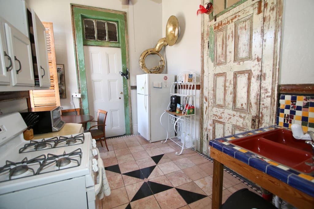 Full kitchen with refrigerator, stove, coffee maker and toaster oven provides you a respite from the wilds of the city and a place to relax.