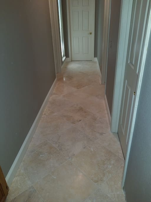 Travertine hallway to bedroom