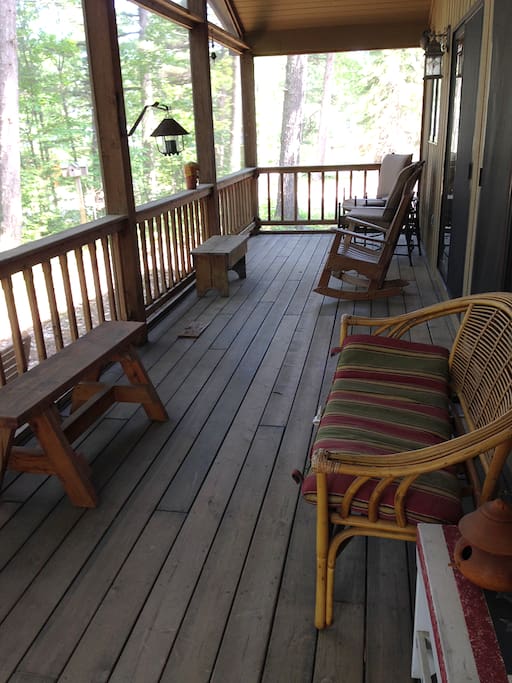 Screened-in deck is a favorite place to relax while watching and listening to the waves.