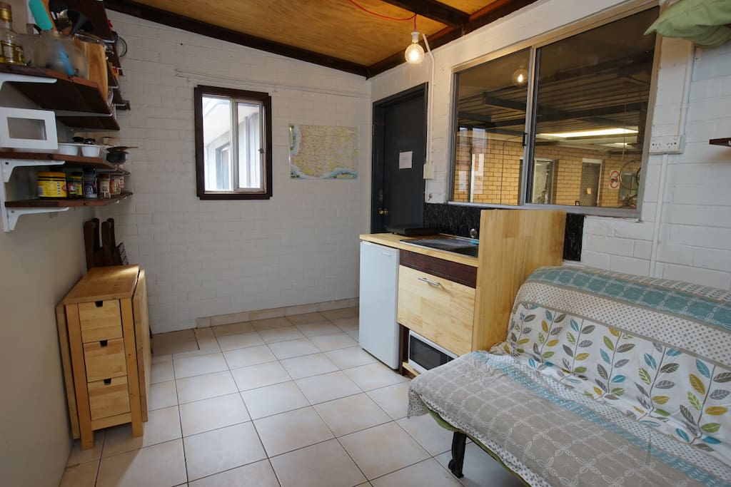 With the bed and table folded away, there is some floor space for dancing