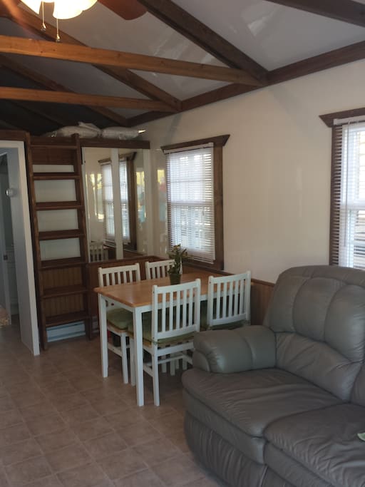Kitchen table and stairs going to the loft