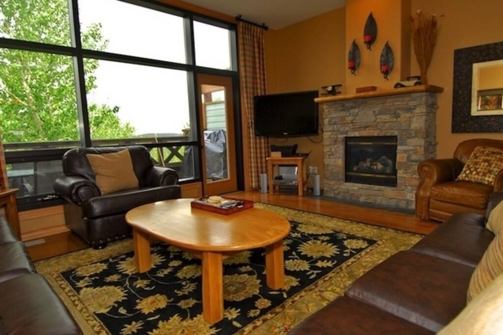 Relax by the beautiful stone fireplace after an awesome day skiing or golfing