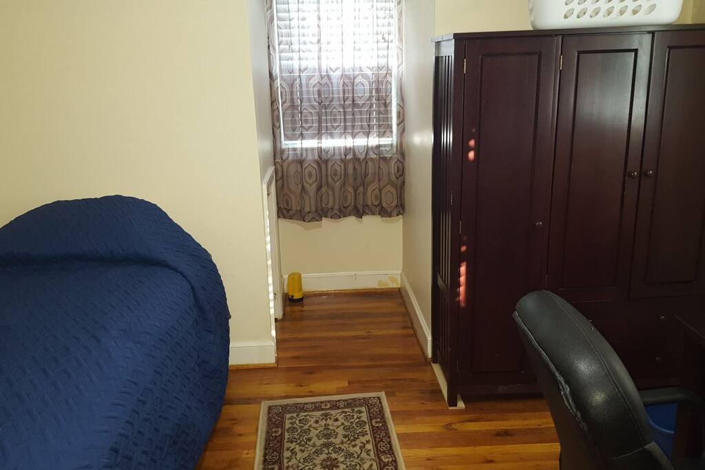 Single twin bed and wardrobe.