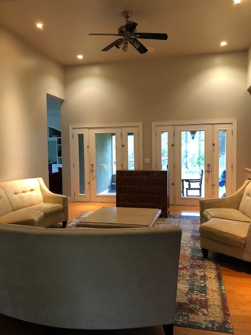 First living room, out to covered patio.