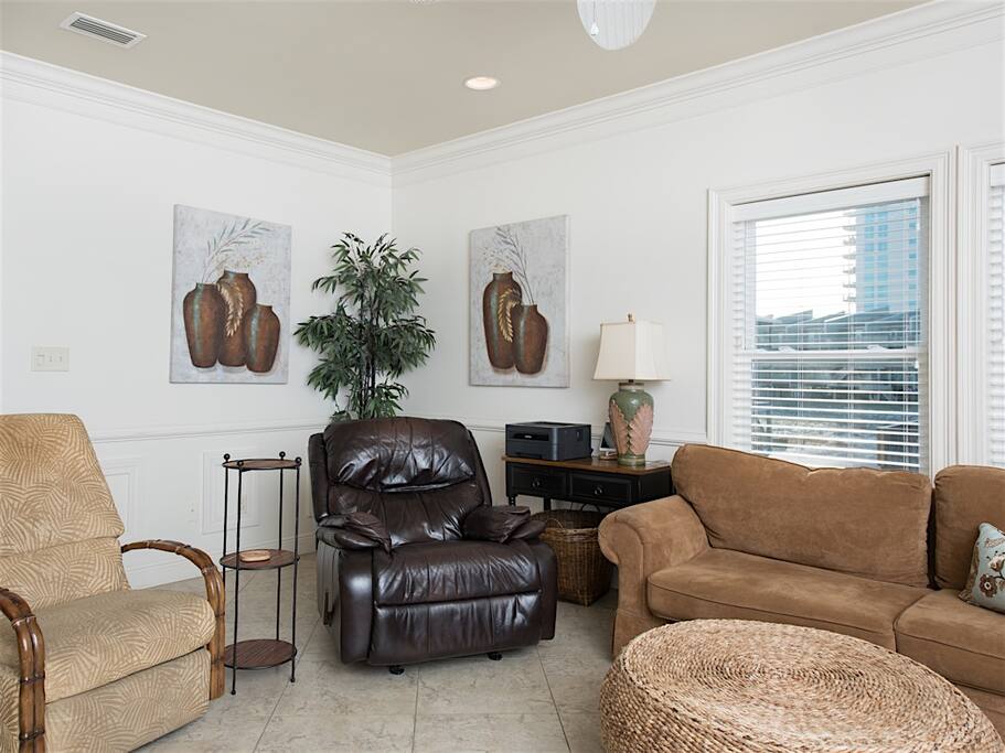 Curl up with a good book on one of the living room's comfy recliners.