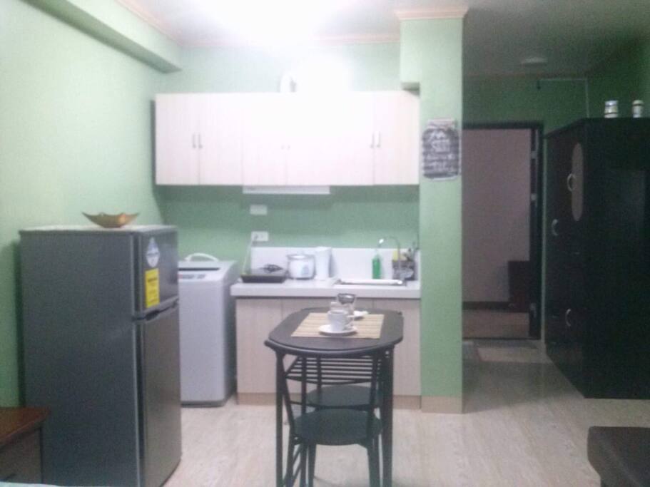 You can cook and wash clothes! With microwave, induction oven and good size refrigerator