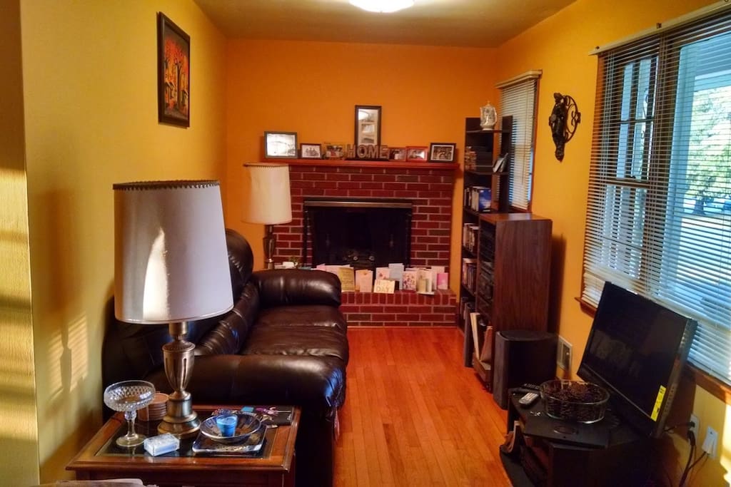 Living room with gas fireplace and satellite television
