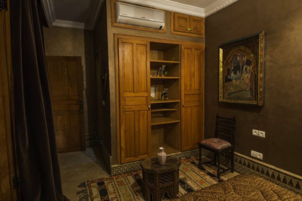 Seating space
Natural wood closet and other shelving for convenience