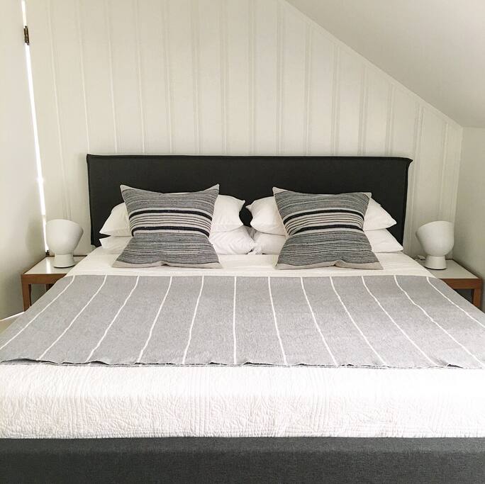 Our luxurious second floor master features a king bed, 2 twin beds, and attached bath with soaking tub.