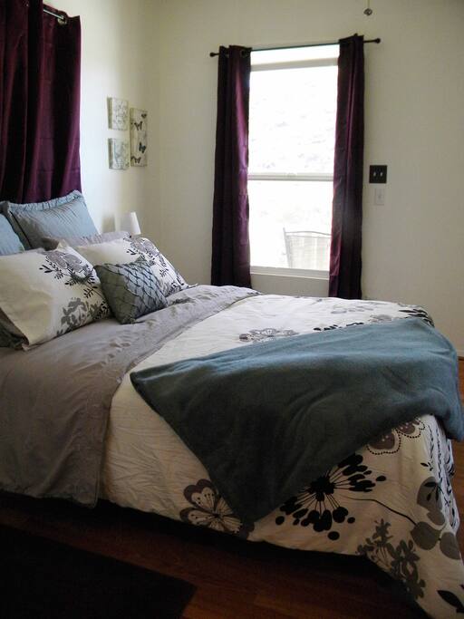 Master bedroom with room darkening curtains.