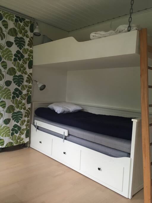 Bedroom with bunkbed and double bed.