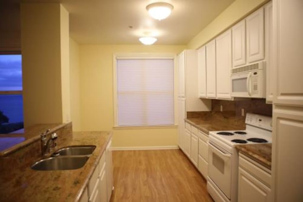 Kitchen with dishwasher, oven, and refrigerator!