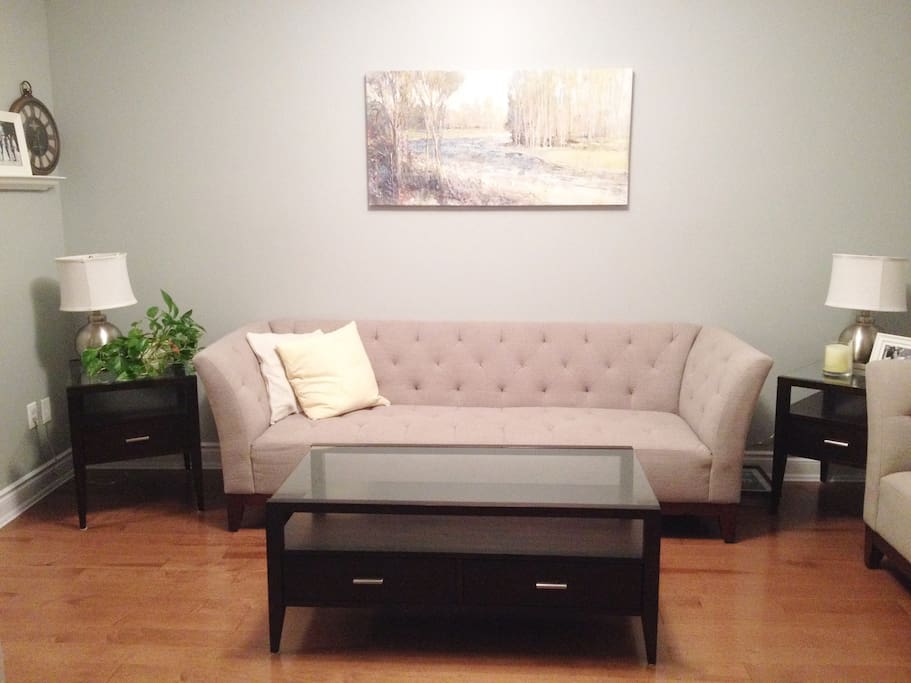 Living Room with lots of seating room and natural light.