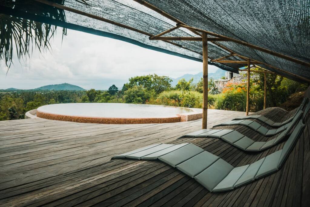 Loungers alongside the shared pool