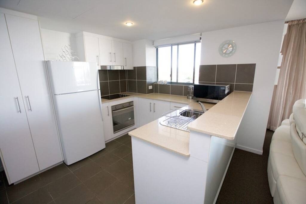 Well equipped kitchen with ocean views & servery to outdoors entertainment area from the window.