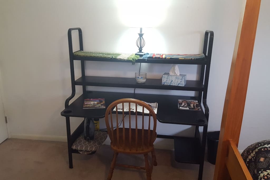Big desk with plenty of outlets. Iron and ironing board underneath.