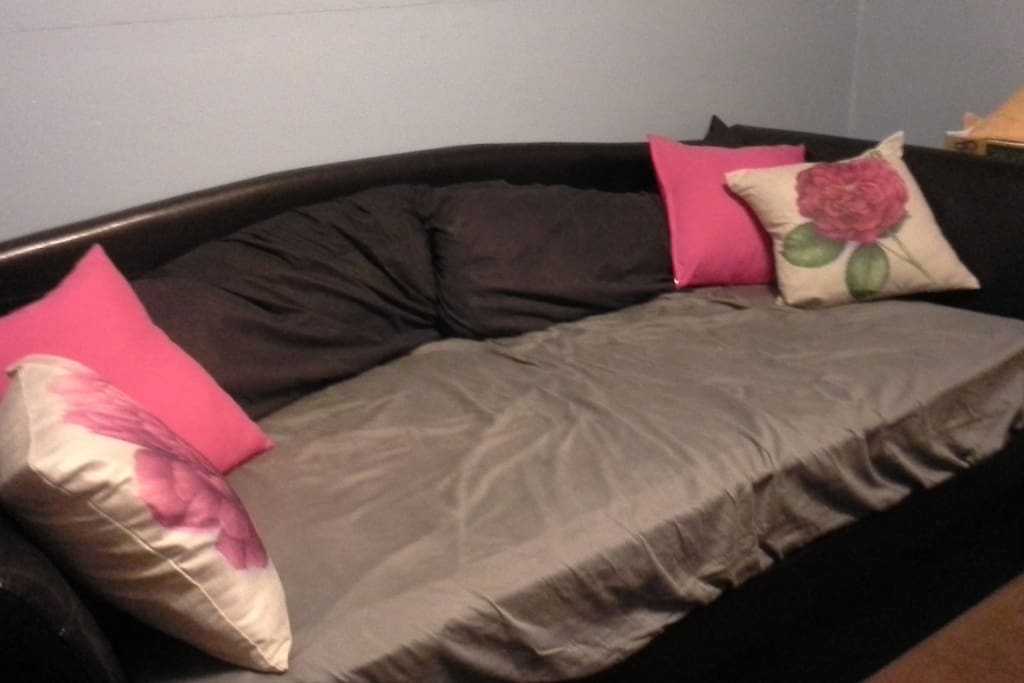 This day bed will be made up with blankets and pillows for a guest. A trundle bed pulls out from underneath it, if there is a second guest.