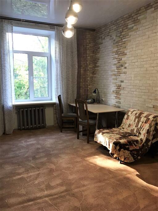 In the separate room there is working table and comfortable armchair