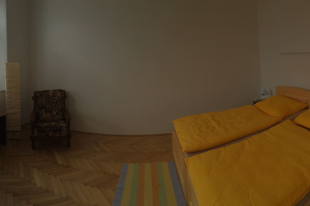 Bedroom with sitting area and cupboards