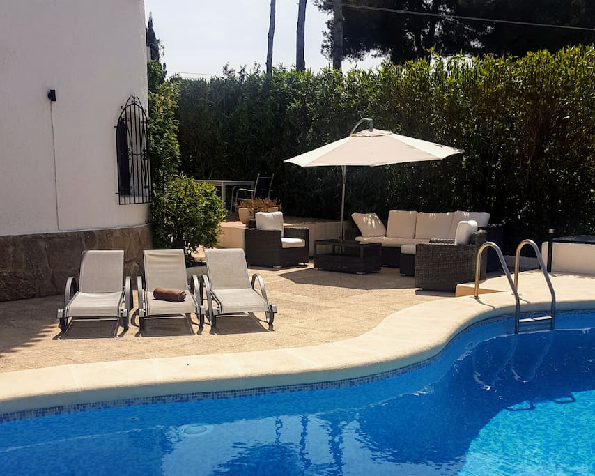 Relaxing in the sun or shade around the pool.
