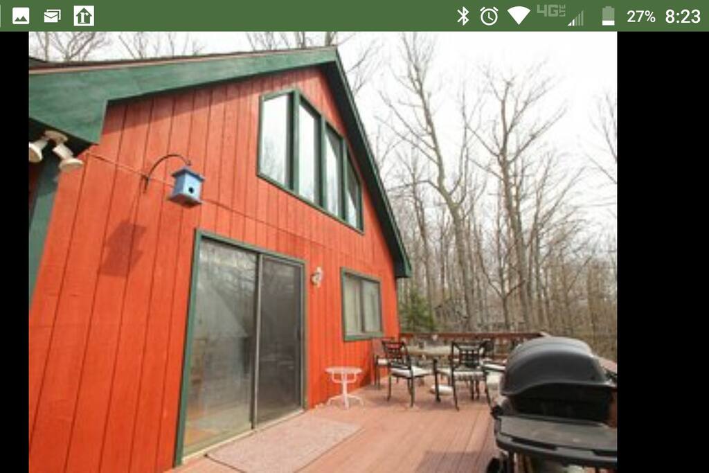 front of house, deck, table/chairs, grill