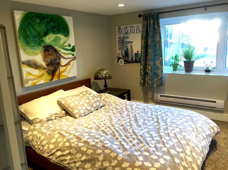 Comfy queen bed & big west-facing window looking out on the back yard.